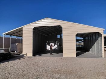 A two-bay garage with a truck parked in it