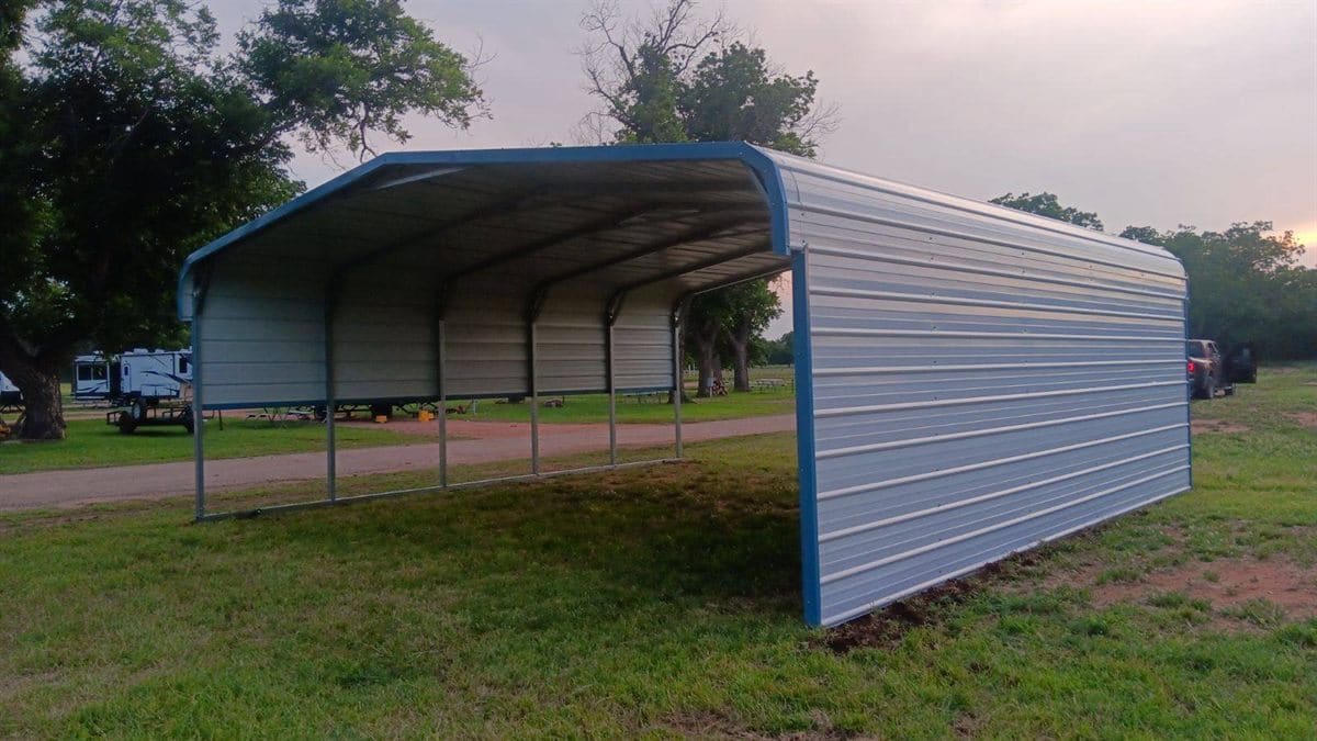 Open steel carport on a gravel pad