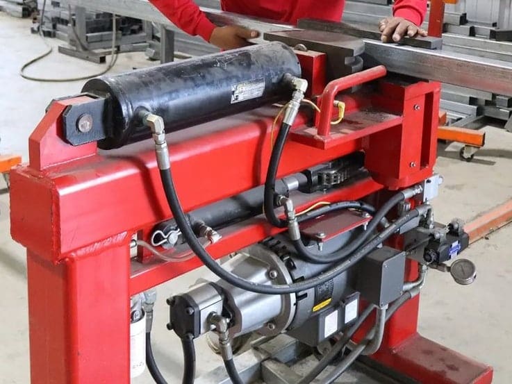 Square tube being fed into the tube builder